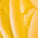 Macro texture of Tropic Lip Love nourishing balm, showing smooth, rich yellow balm for soft and hydrated lips.